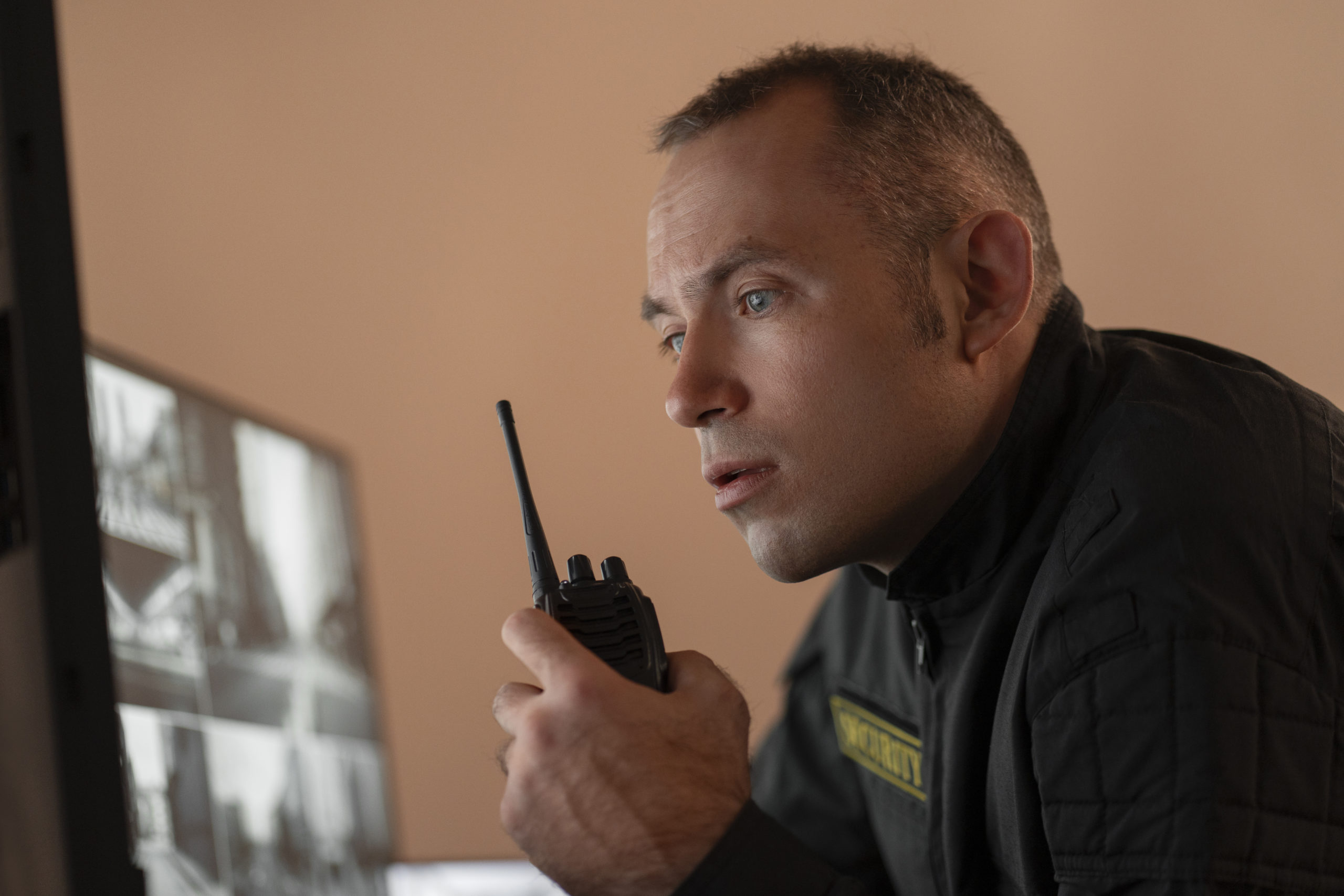 Radio operator monitoring camera screens