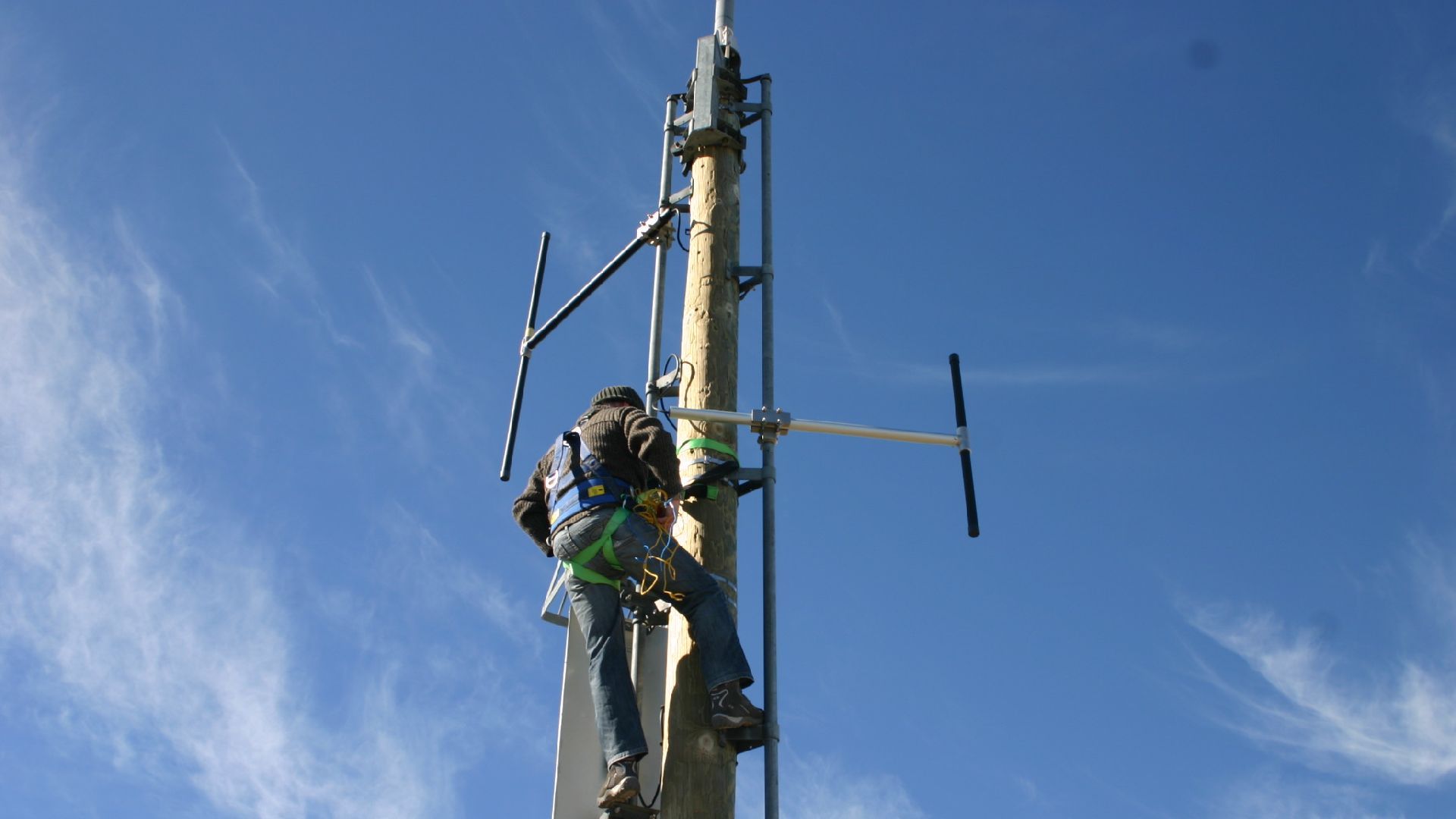 Technician working on site antennas
