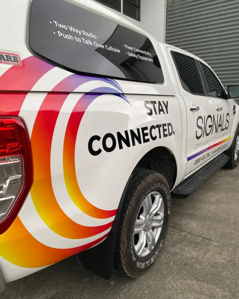 Signals NZ service ute, signwritten ‘Stay connected’ with two-way radio and push-to-talk over cellular listed on the canopy
